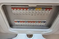 Electrical panel with labeled switches on a 2006 Nimbus 350 Coupe boat.