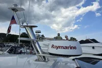 Nimbus 350 Coupe 2006 with Raymarine equipment, docked under a cloudy sky.