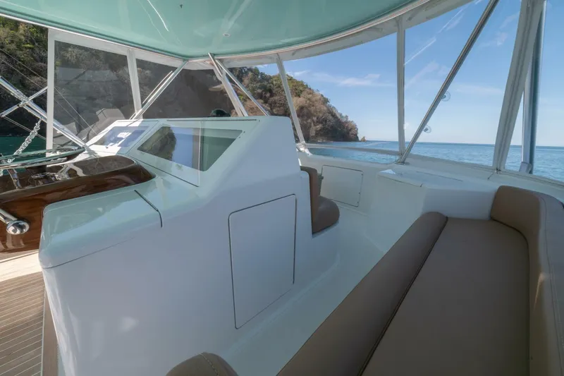 Scandaloso Yacht Photos Pics Interior view of 2006 Viking 56 yacht helm with ocean backdrop.