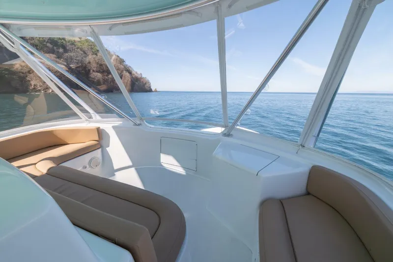 Scandaloso Yacht Photos Pics Luxurious interior of 2006 Viking 56 yacht with ocean view.