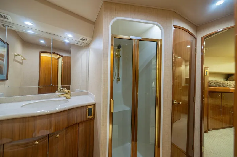 Scandaloso Yacht Photos Pics Luxurious bathroom interior of 2006 Viking 56 yacht with shower and vanity.