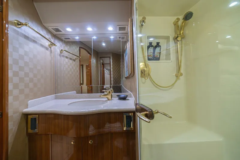 Scandaloso Yacht Photos Pics Luxurious bathroom in 2006 Viking 56 yacht with elegant fixtures and spacious shower.