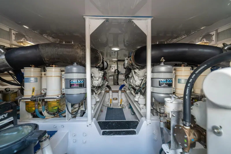 Scandaloso Yacht Photos Pics Engine room of a 2006 Viking 56 yacht, featuring dual engines and CRS 300 systems.