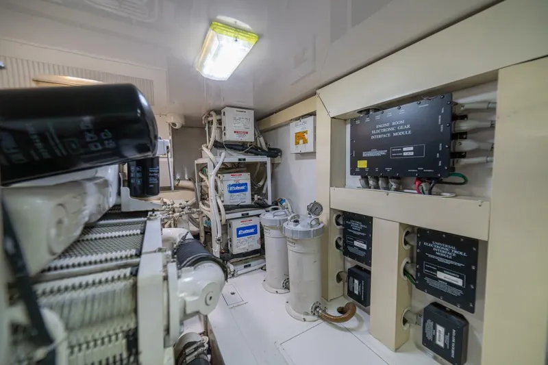 Scandaloso Yacht Photos Pics Engine room of 2006 Viking 56 yacht with electronic gear interface modules.