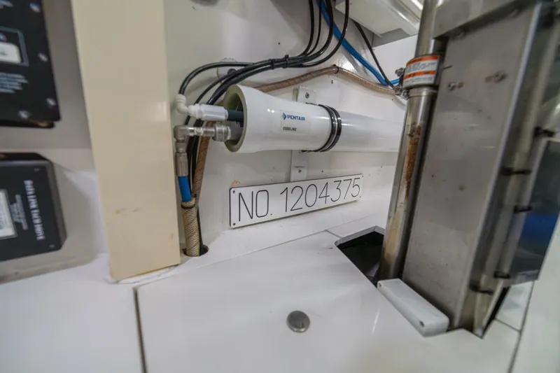 Scandaloso Yacht Photos Pics Engine room detail of a 2006 Viking 56 yacht, featuring a Pentair Coolline system.