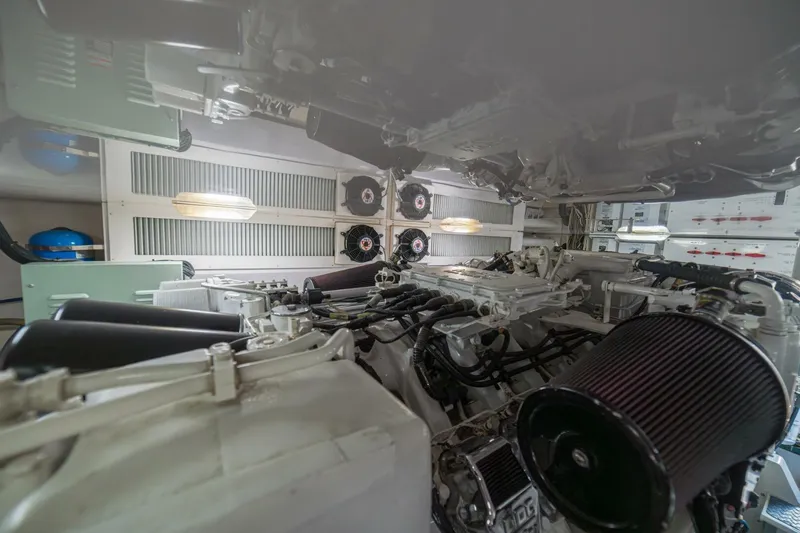 Scandaloso Yacht Photos Pics Engine room of a 2006 Viking 56 yacht, showcasing machinery and components.
