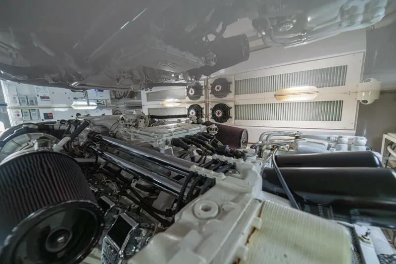 Scandaloso Yacht Photos Pics Engine room of a 2006 Viking 56 yacht, showcasing mechanical components and systems.