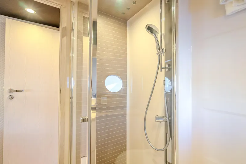  Yacht Photos Pics Luxurious shower area in 2019 Azimut 66 yacht, featuring modern fixtures and elegant design.