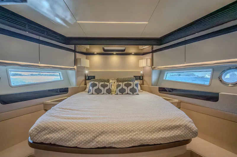  Yacht Photos Pics Luxurious bedroom interior of 2019 Azimut 66 yacht with modern design and elegant bedding.
