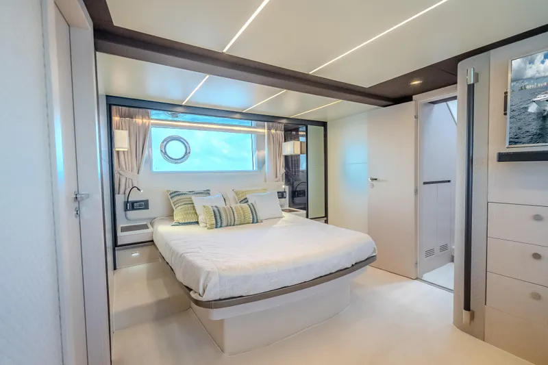  Yacht Photos Pics Luxurious bedroom interior of 2019 Azimut 66 yacht, featuring modern design and elegant decor.