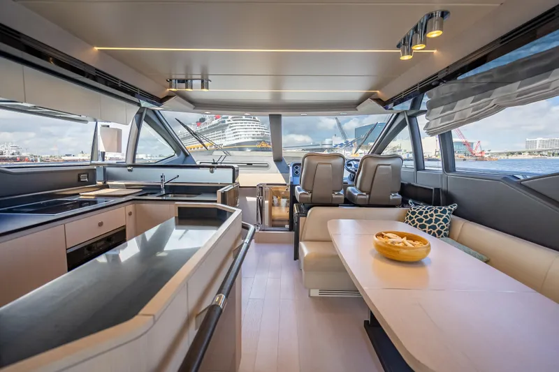  Yacht Photos Pics Luxurious interior of 2019 Azimut 66 yacht with modern kitchen and seating area.