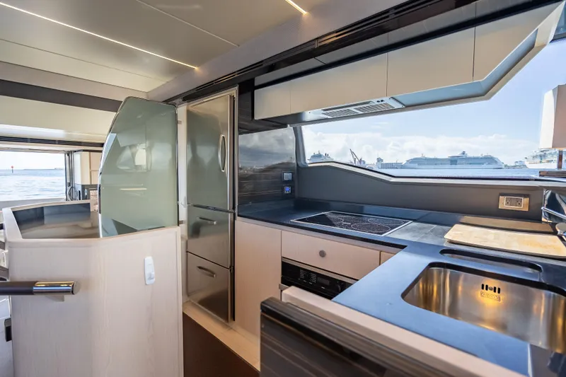 Yacht Photos Pics Luxurious kitchen interior of 2019 Azimut 66 yacht with modern appliances and ocean view.