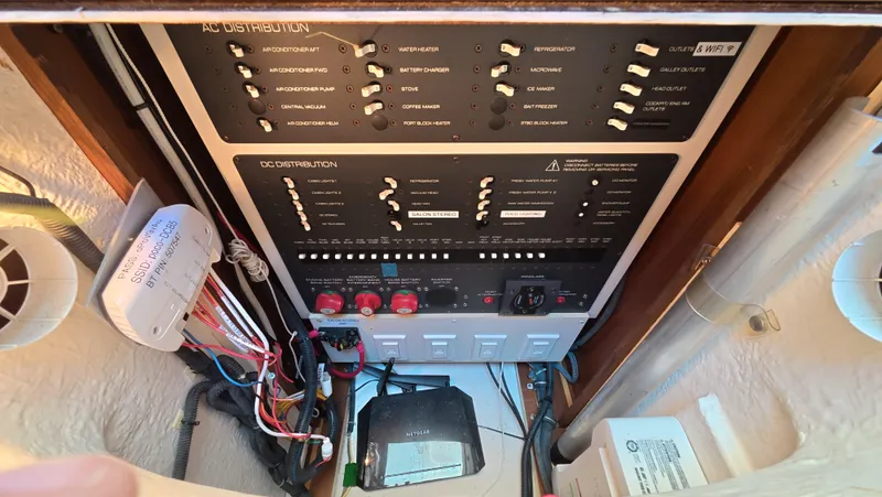  Yacht Photos Pics Electrical control panel inside 2019 Tiara Yachts Sovran, showcasing wiring and switches.