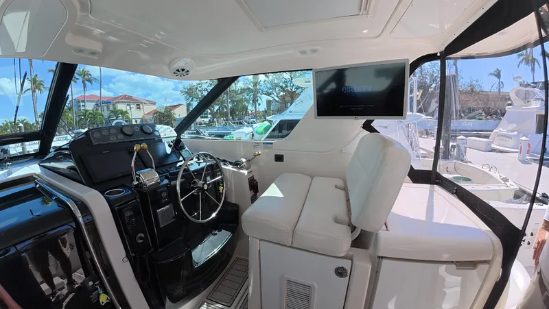  Yacht Photos Pics 2019 Tiara Yachts Sovran helm with modern controls and plush seating.