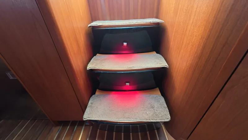  Yacht Photos Pics Staircase with red lighting in 2019 Tiara Yachts Sovran interior.