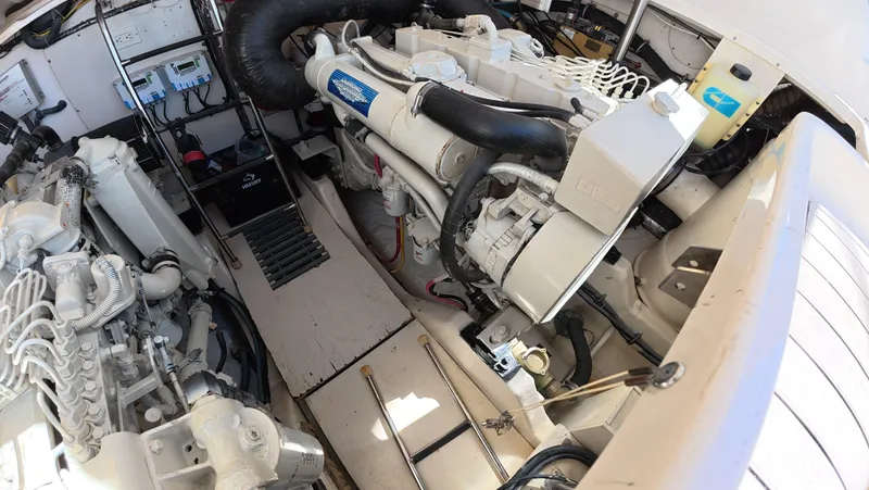  Yacht Photos Pics Engine room of 2019 Tiara Yachts Sovran, showcasing mechanical components and layout.