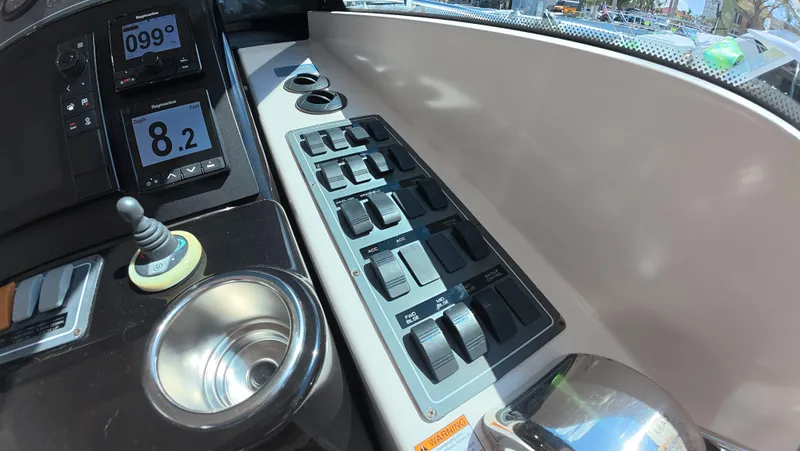  Yacht Photos Pics Control panel of 2019 Tiara Yachts Sovran, featuring switches and digital displays.