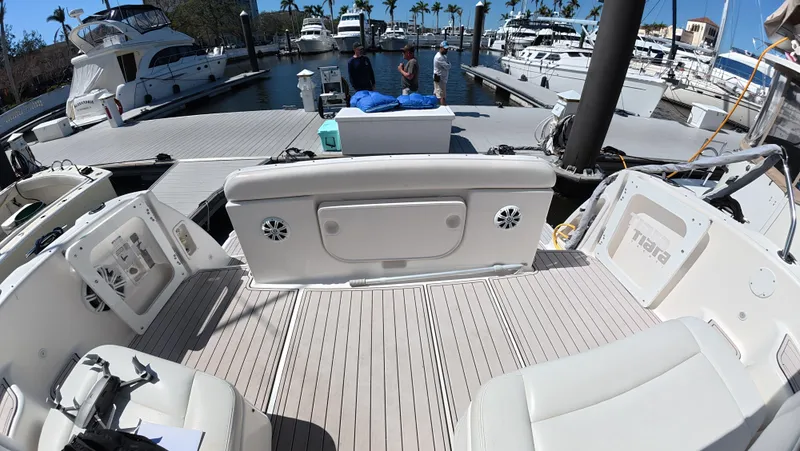  Yacht Photos Pics 2019 Tiara Yachts Sovran at marina, featuring spacious deck and luxurious seating.