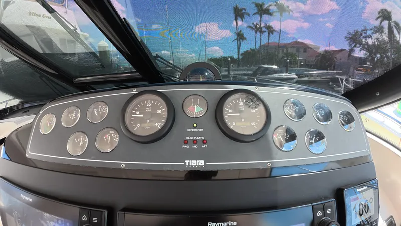  Yacht Photos Pics 2019 Tiara Yachts Sovran dashboard with gauges and controls, under a clear blue sky.