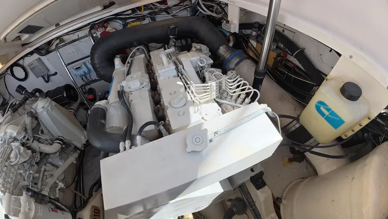  Yacht Photos Pics Engine compartment of 2019 Tiara Yachts Sovran, showcasing mechanical components and wiring.