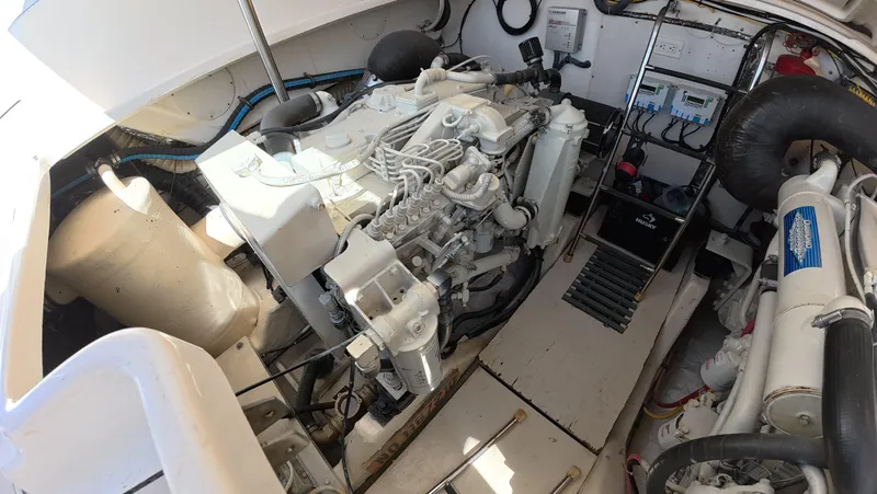  Yacht Photos Pics Engine room of 2019 Tiara Yachts Sovran, showcasing mechanical components and layout.