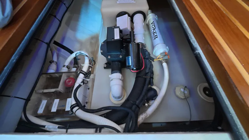  Yacht Photos Pics Engine compartment of 2019 Tiara Yachts Sovran, showcasing plumbing and mechanical components.