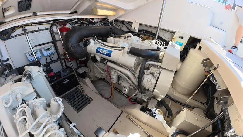  Yacht Photos Pics Engine room of 2019 Tiara Yachts Sovran, showcasing mechanical components and layout.