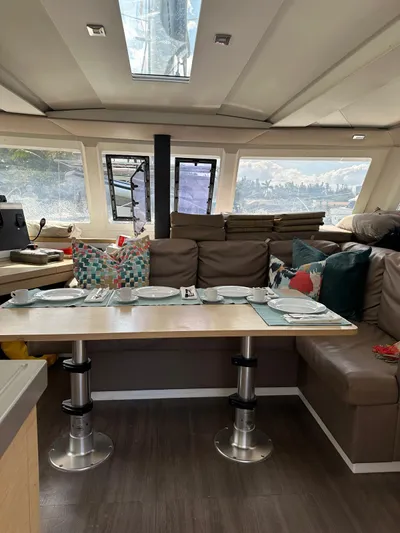 Vahevala Yacht Photos Pics Interior of 2019 Fountaine Pajot Lucia 40 catamaran with dining area and plush seating.