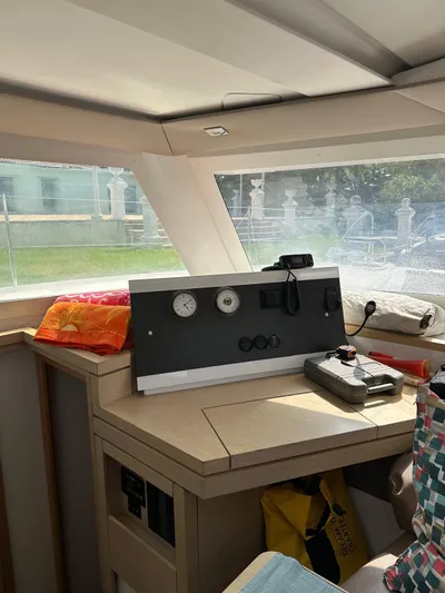 Vahevala Yacht Photos Pics Interior of 2019 Fountaine Pajot Lucia 40 catamaran with navigation instruments and bright natural light.