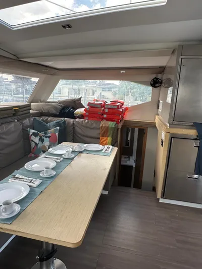 Vahevala Yacht Photos Pics Interior of 2019 Fountaine Pajot Lucia 40 catamaran with dining table and seating area.