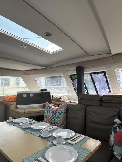 Vahevala Yacht Photos Pics Interior of 2019 Fountaine Pajot Lucia 40 catamaran with dining setup and skylight.