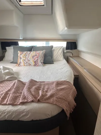 Vahevala Yacht Photos Pics Cozy bedroom in 2019 Fountaine Pajot Lucia 40 catamaran with stylish bedding and natural light.