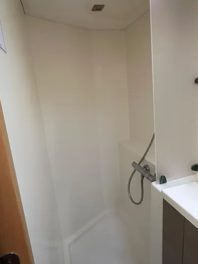 Vahevala Yacht Photos Pics Shower area in 2019 Fountaine Pajot Lucia 40 catamaran, featuring modern fixtures.