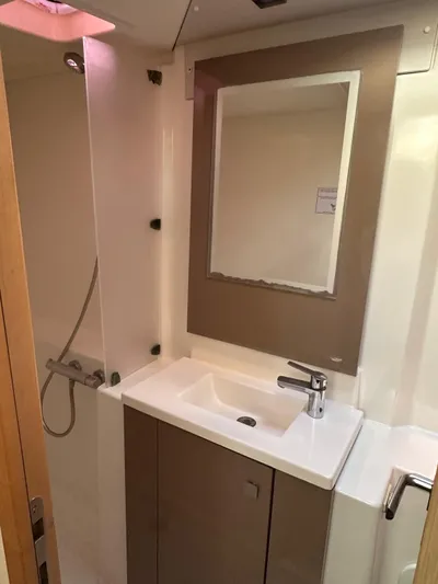 Vahevala Yacht Photos Pics Modern bathroom in 2019 Fountaine Pajot Lucia 40 catamaran with sink, mirror, and shower.
