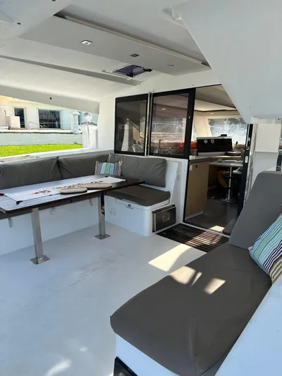 Vahevala Yacht Photos Pics 2019 Fountaine Pajot Lucia 40 catamaran interior with spacious seating and dining area.