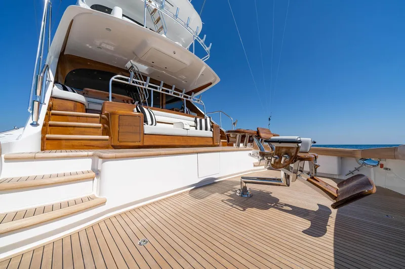 New Build Yacht Photos Pics Luxurious 2026 Viking 90 Sky Bridge yacht deck with seating and fishing chair.