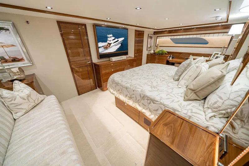 New Build Yacht Photos Pics Luxurious bedroom interior of 2026 Viking 90 Sky Bridge yacht with elegant decor.