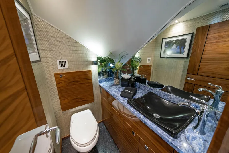 New Build Yacht Photos Pics Luxurious bathroom in 2026 Viking 90 Sky Bridge yacht with modern fixtures and elegant design.