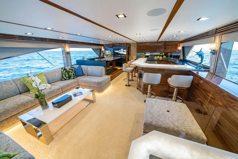 New Build Yacht Photos Pics Luxurious interior of 2026 Viking 90 Sky Bridge yacht with modern furnishings and ocean view.