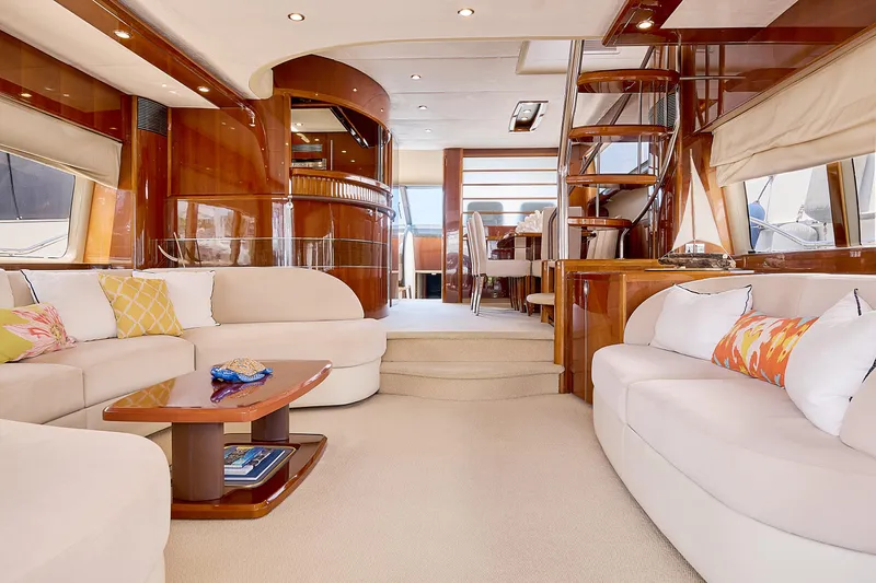  Yacht Photos Pics Luxurious interior of 2009 Princess 23M yacht with elegant seating and wooden finishes.