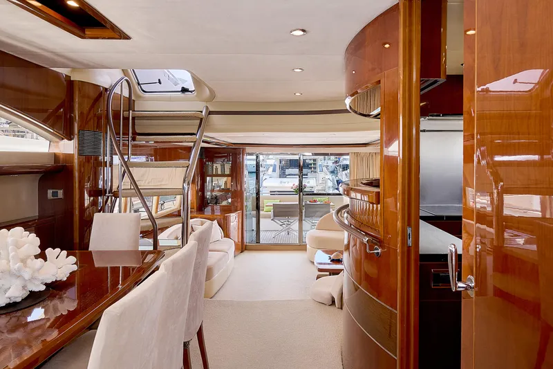  Yacht Photos Pics Luxurious interior of 2009 Princess 23M yacht with elegant wood finishes and modern design.