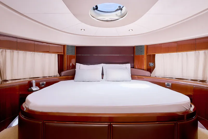  Yacht Photos Pics Luxurious cabin interior of 2009 Princess 23M yacht with elegant wood finish.