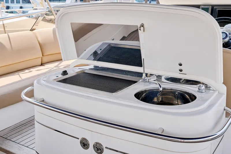  Yacht Photos Pics Luxury yacht Princess 23M 2009 with onboard sink and grill in open deck area.