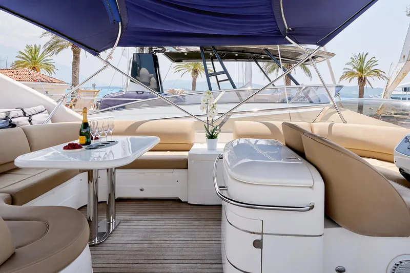  Yacht Photos Pics Luxurious 2009 Princess 23M yacht interior with elegant seating, table, and champagne setup.