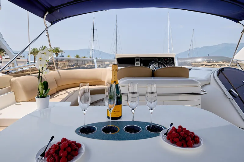  Yacht Photos Pics Luxurious 2009 Princess 23M yacht with champagne, raspberries, and elegant seating.