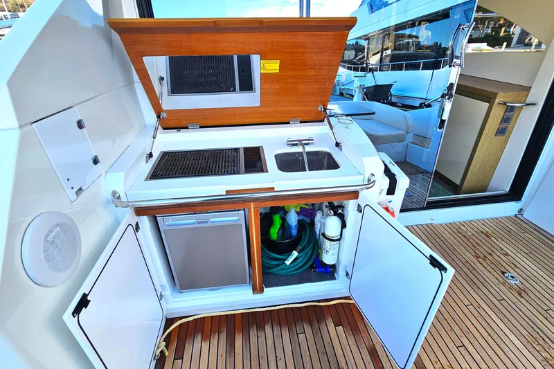Magic Carpet Yacht Photos Pics BBQ Galley Cabinet with Sink, Frig and Storage