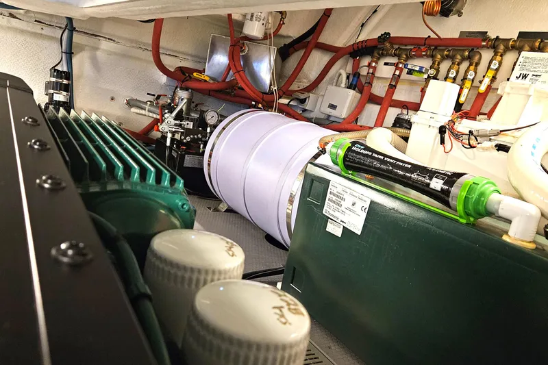 Magic Carpet Yacht Photos Pics Portside Engine Room, Hot water heater, Holding tank and Hydronic heating manifold for 4 separate zones. Plumbed to hot water heater.