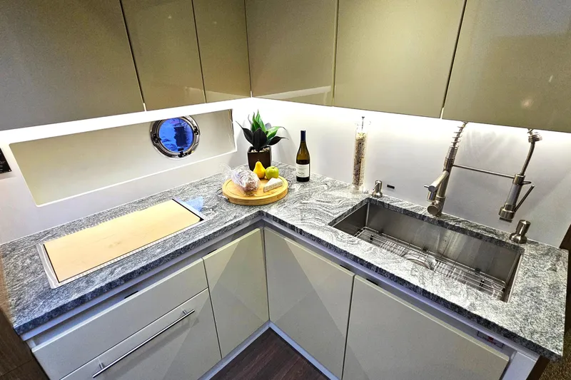 Magic Carpet Yacht Photos Pics Luxurious Galley with modern amenities and loads of storage in cabinets above and below