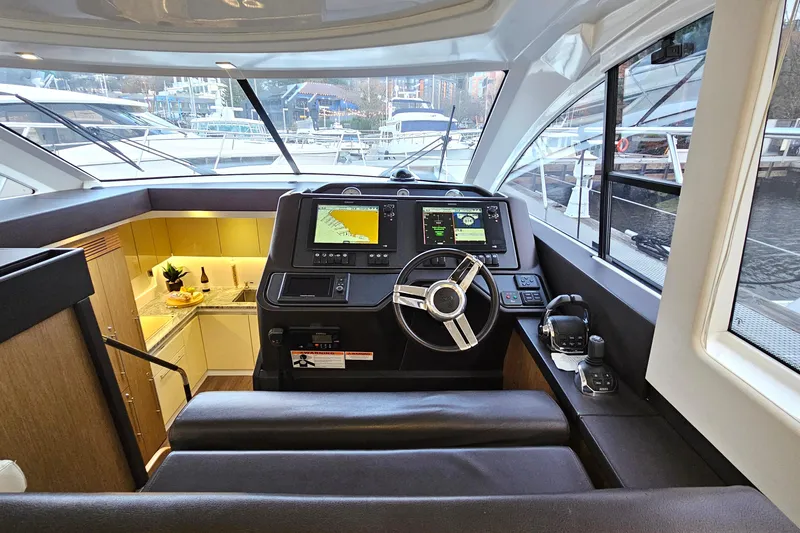 Magic Carpet Yacht Photos Pics Double helm seat, Full Simrad Navigation and Down Galley