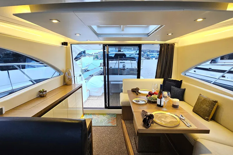 Magic Carpet Yacht Photos Pics Salon, Aft View. Two stage rear salon doors - fully opens the salon to cockpit for entertaining